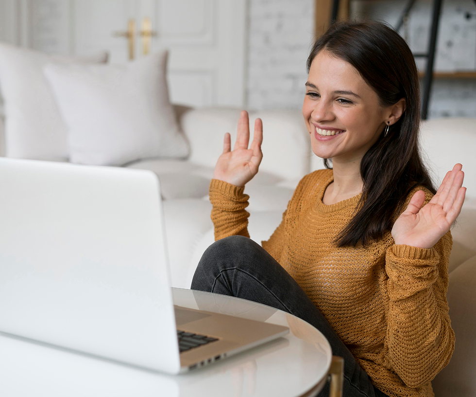 Woman waving at laptop with ratings UI