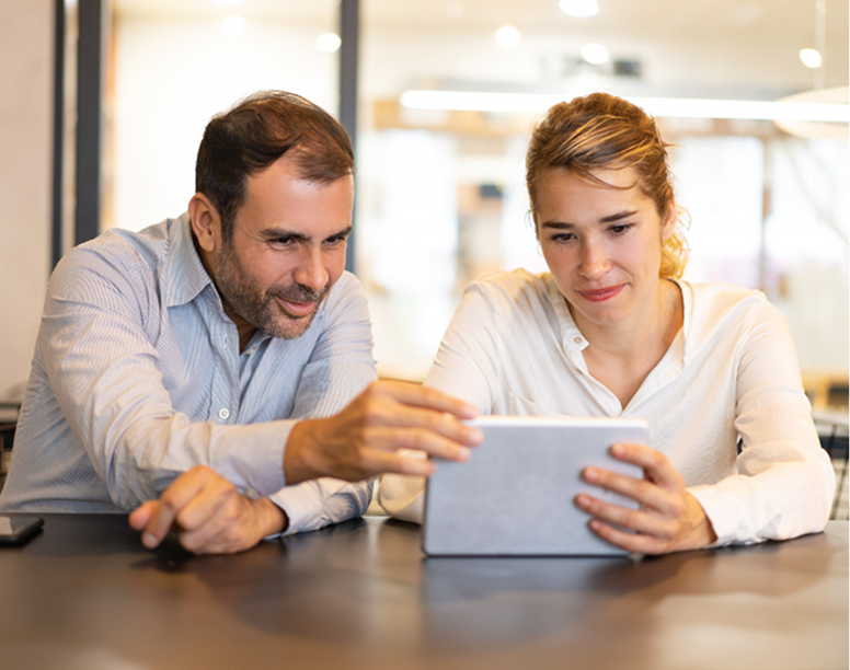 Two people engaging with a webinar on a tablet
